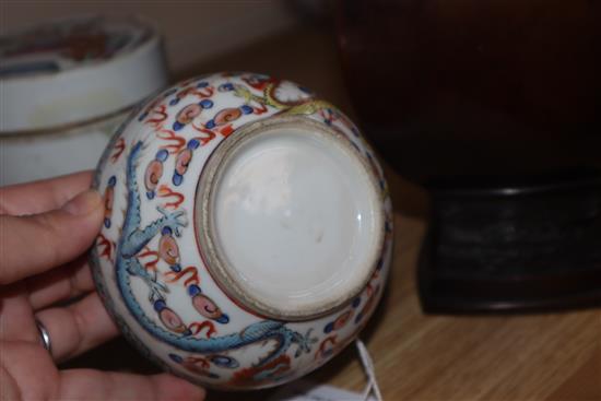 Two Chinese famille rose lidded pots and a circular pot